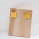 Boucles d'oreilles Maiandros Poupadou, vues de face