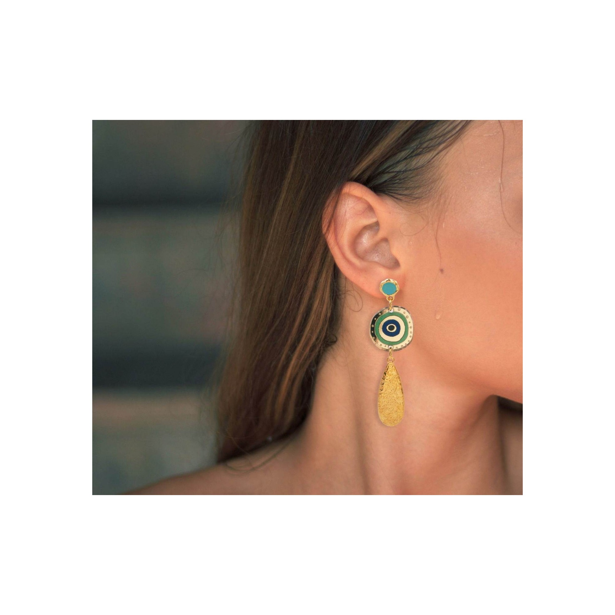 Mati Plexiglass Earrings POUPADOU, wore by a woman