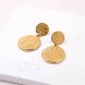 Gold-plated Phaistos Disc Earrings POUPADOU, top view