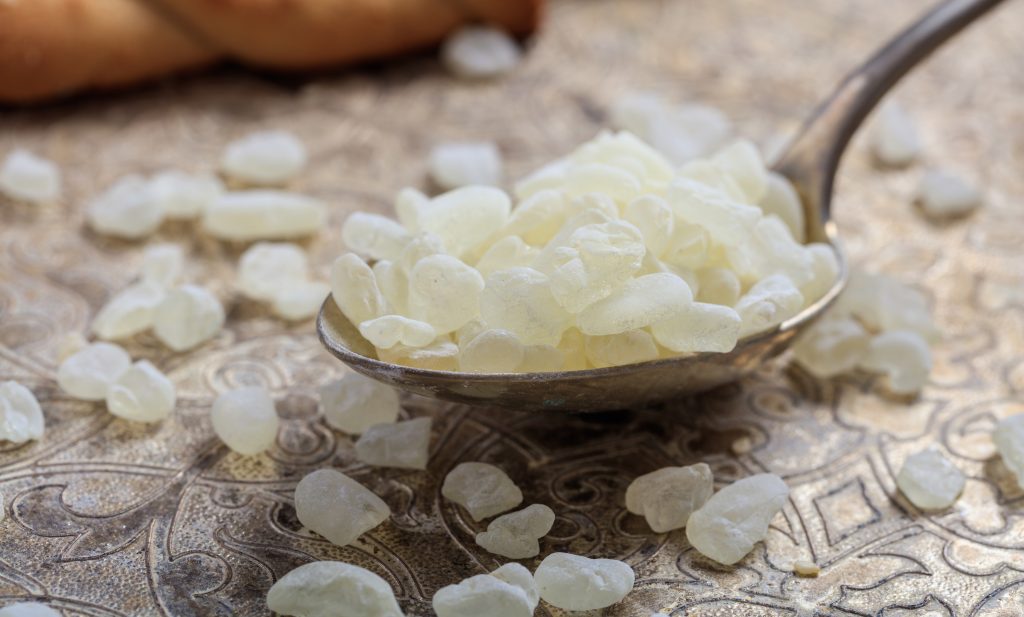 Chios mastic tears in a spoon on a silver background