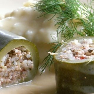 stuffed zucchinis in an avgolemono sauce