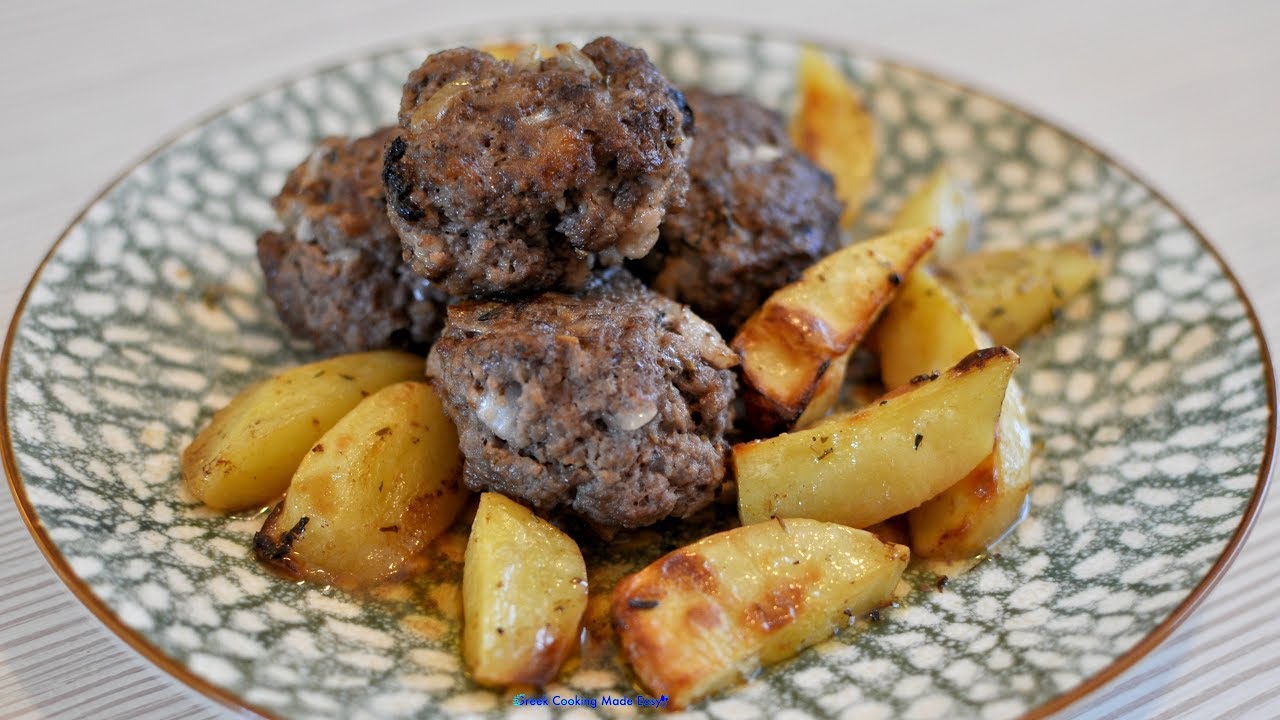 Baked Biftekia with potatoes and lemon