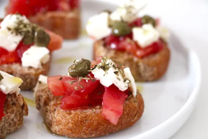 Greek dish with tomatoes, feta, olives, olive oil and greek paximadi 