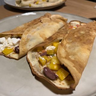 Crepes with feta cheese, tomatoes and olives